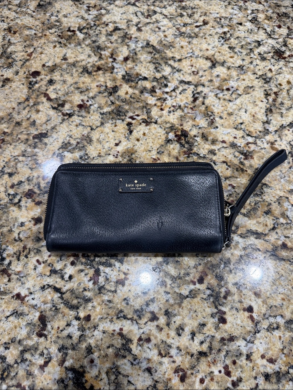 kate spade black leather zip wristlet with gold plaque